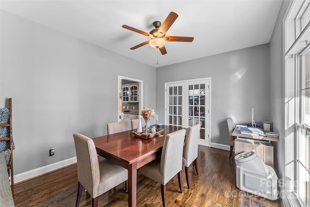 dining area with french doors, ceiling fan, a healthy amount of sunlight, and dark hardwood / wood-style flooring