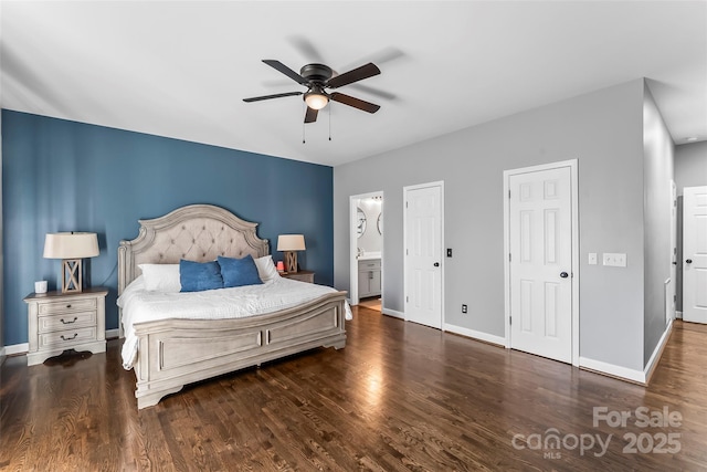 bedroom with ceiling fan, ensuite bathroom, and dark hardwood / wood-style floors