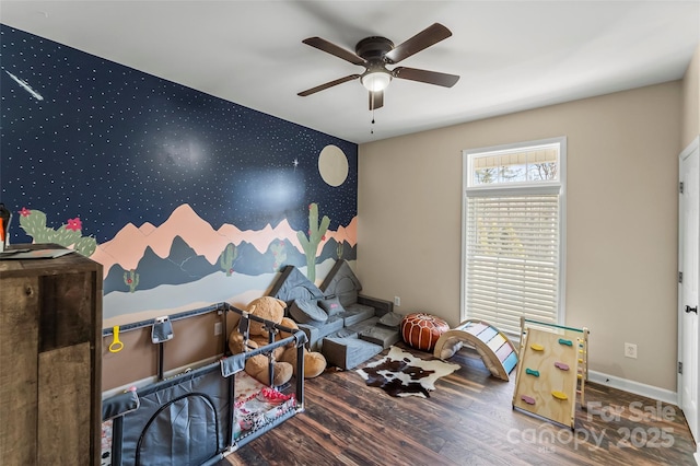 playroom featuring hardwood / wood-style floors and ceiling fan