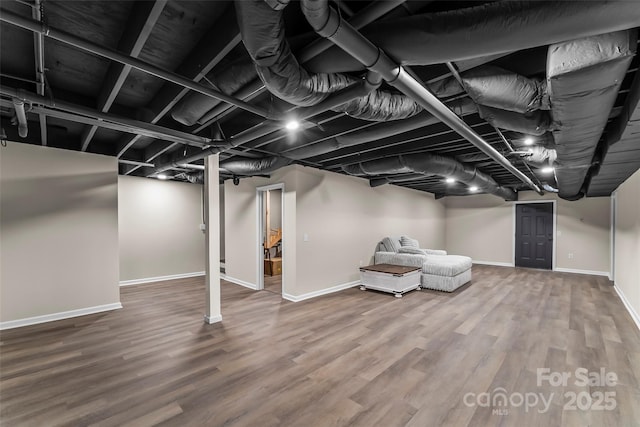 basement featuring hardwood / wood-style flooring