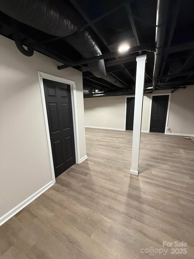 basement featuring hardwood / wood-style flooring