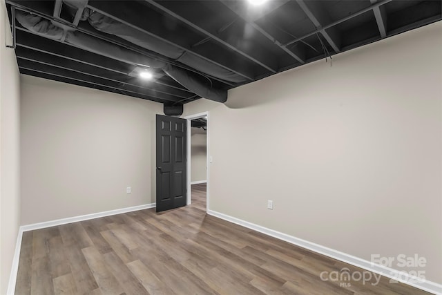 basement featuring wood-type flooring