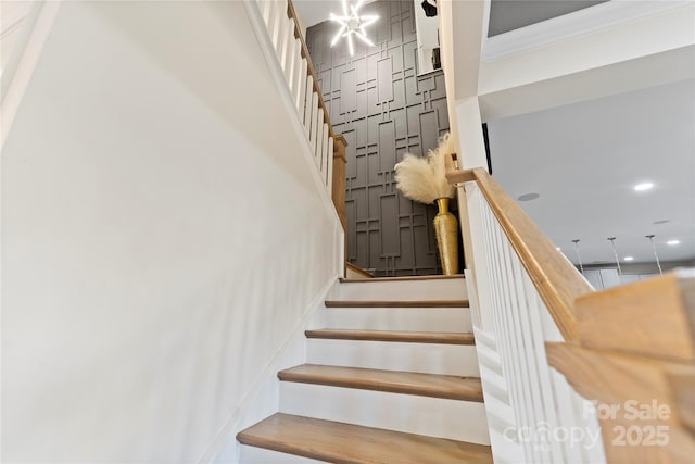 staircase featuring ornamental molding