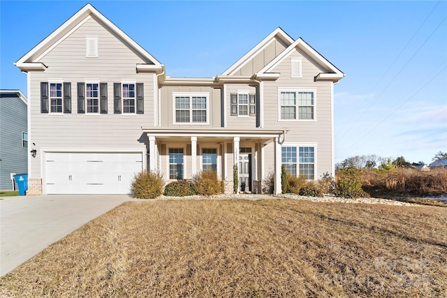 view of front of home with a garage and a front yard