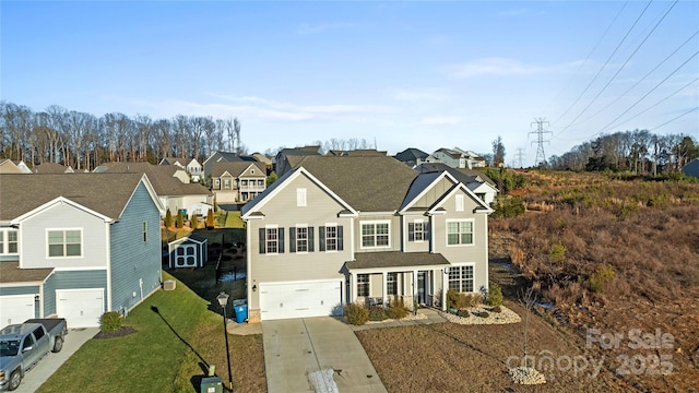 view of front of property featuring a garage and a front yard