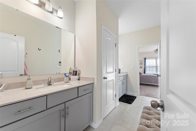 bathroom with tile patterned flooring and vanity