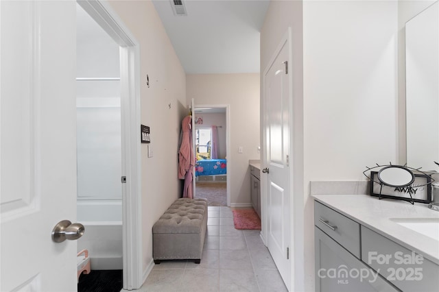 bathroom featuring tile patterned floors and vanity