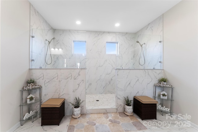 bathroom featuring tiled shower and tile walls