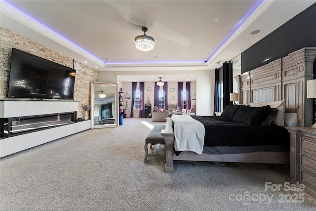 carpeted bedroom featuring a raised ceiling