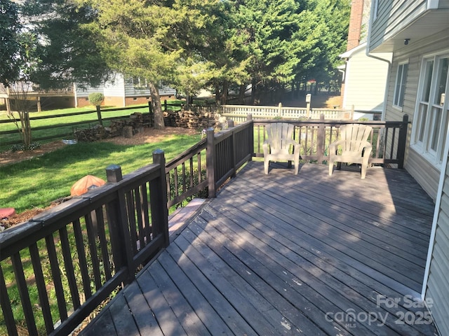 deck featuring a lawn