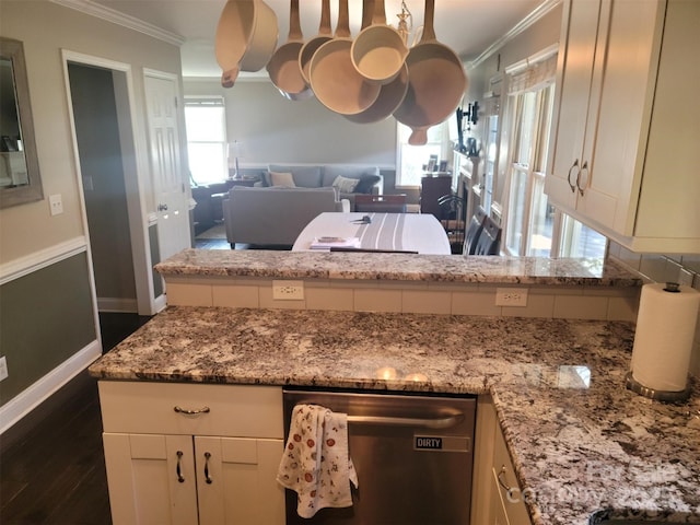 kitchen featuring dark wood-style floors, open floor plan, light stone countertops, crown molding, and stainless steel dishwasher