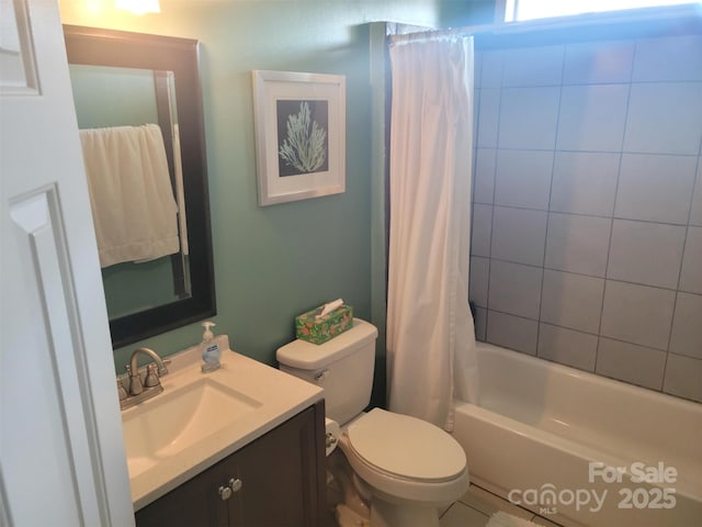 bathroom with shower / bath combo, vanity, and toilet