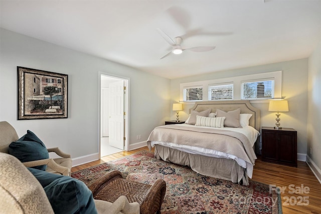 bedroom with light wood-type flooring, baseboards, and a ceiling fan