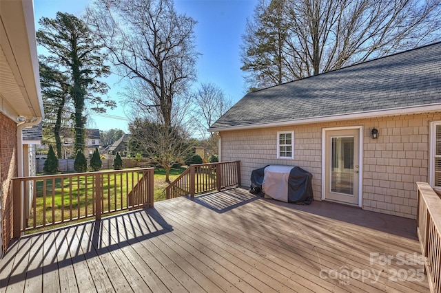 wooden terrace with grilling area