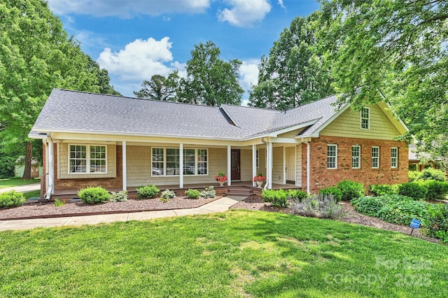 7135 Folger Dr, Charlotte, NC 28270 - single story home featuring covered porch, a front yard, roof with shingles, and brick siding