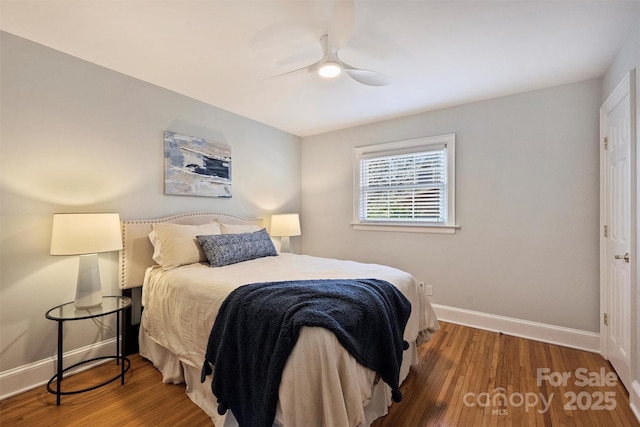 7135 Folger Dr, Charlotte, NC 28270 - bedroom with baseboards, wood finished floors, and ceiling fan