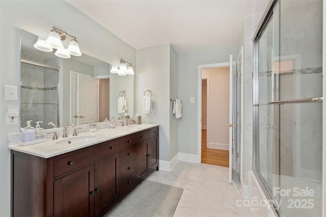 7135 Folger Dr, Charlotte, NC 28270 - bathroom featuring marble look tile flooring, a shower stall, double vanity, and baseboards