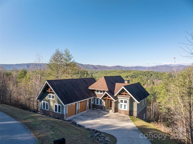 view of front of house with a mountain view and a garage