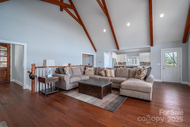 living room with high vaulted ceiling, beam ceiling, and hardwood / wood-style flooring