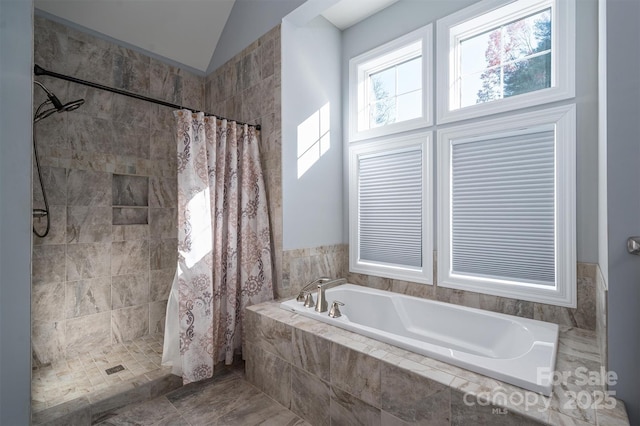 bathroom with separate shower and tub and vaulted ceiling