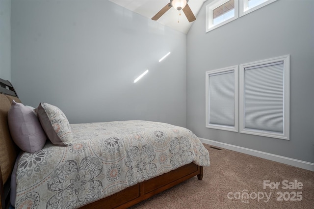 bedroom featuring ceiling fan, carpet, and lofted ceiling