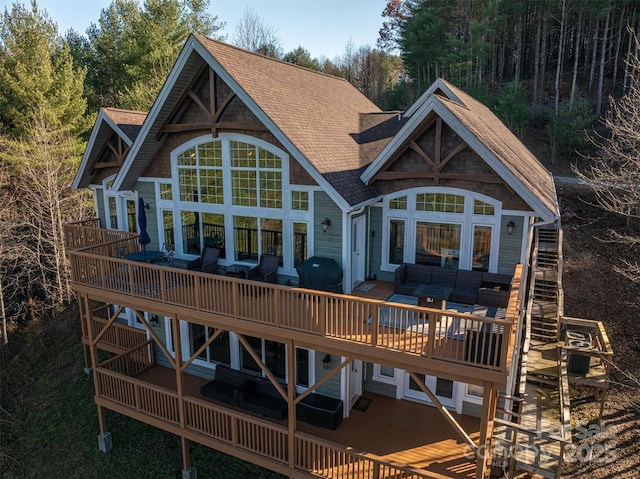 back of property featuring outdoor lounge area and a deck