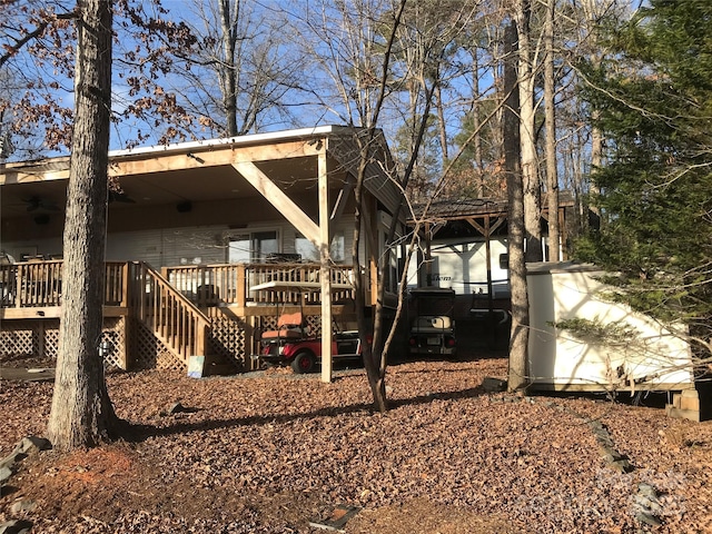 back of property featuring a wooden deck