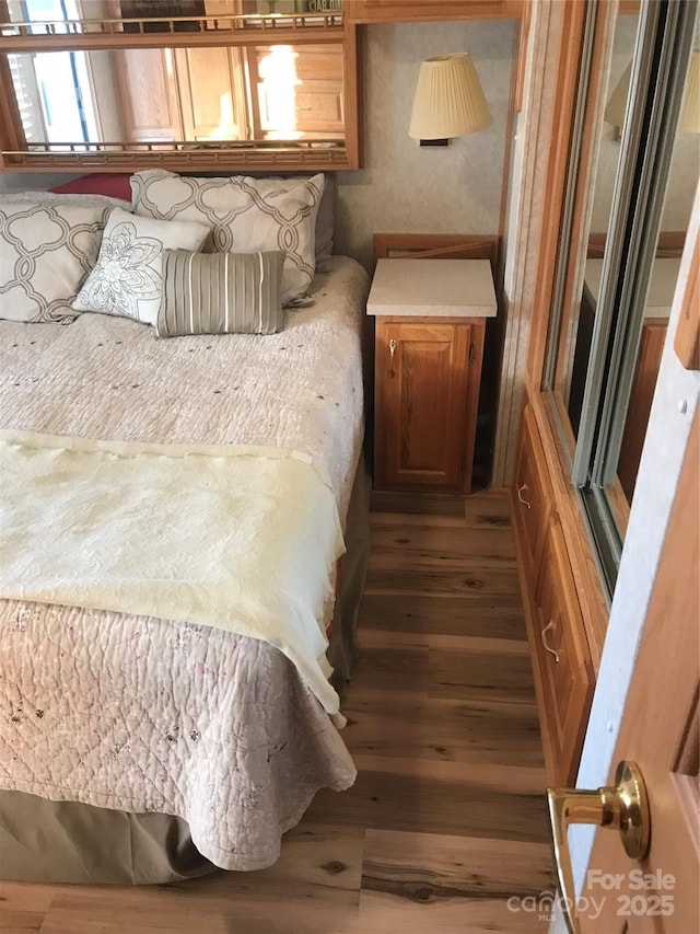 bedroom featuring hardwood / wood-style floors