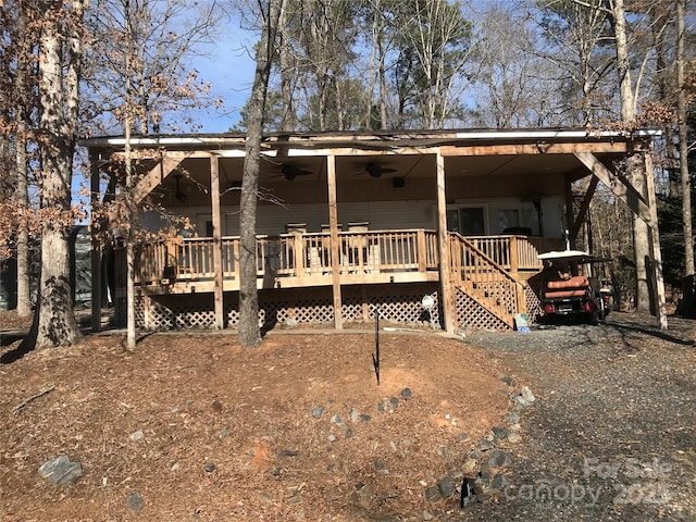 view of front of home featuring a wooden deck and ceiling fan