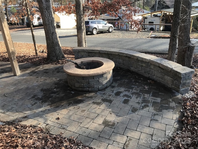 view of patio featuring an outdoor fire pit