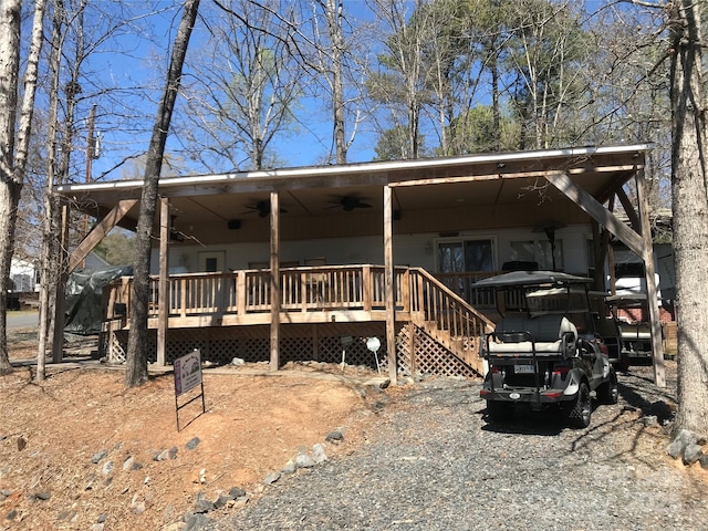 manufactured / mobile home with a deck and a ceiling fan