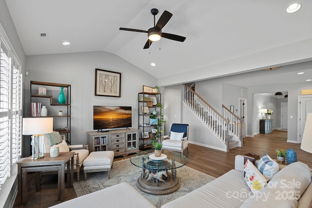 living room with ceiling fan, wood-type flooring, and vaulted ceiling