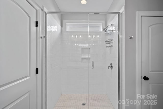 bathroom with a shower with shower door