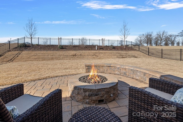 view of patio / terrace featuring an outdoor fire pit