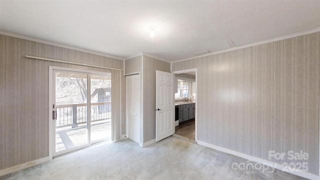 unfurnished room featuring ornamental molding, wine cooler, and baseboards