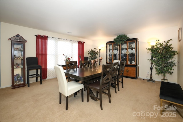 view of carpeted dining space