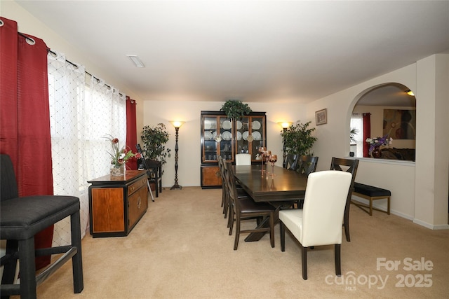 dining space with light carpet