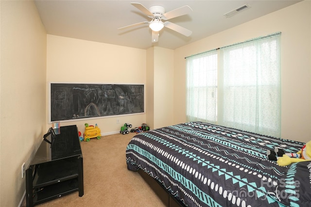 bedroom featuring ceiling fan and light colored carpet