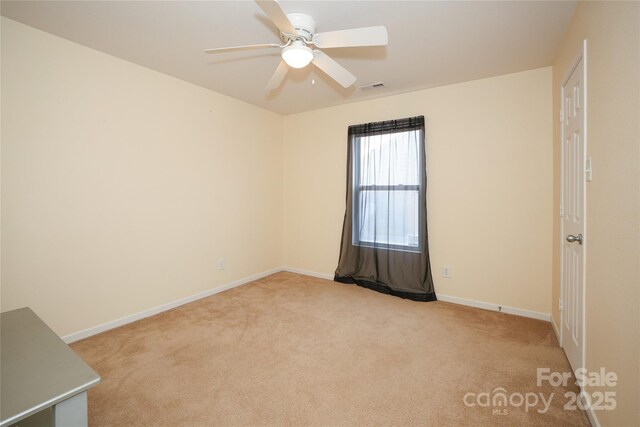 carpeted empty room with ceiling fan