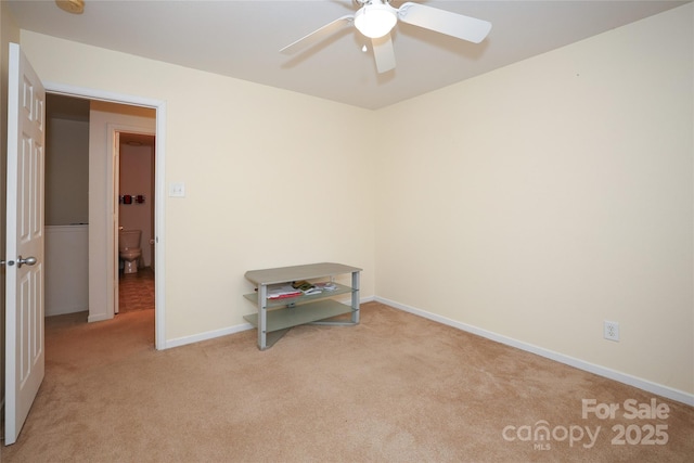 carpeted empty room with ceiling fan