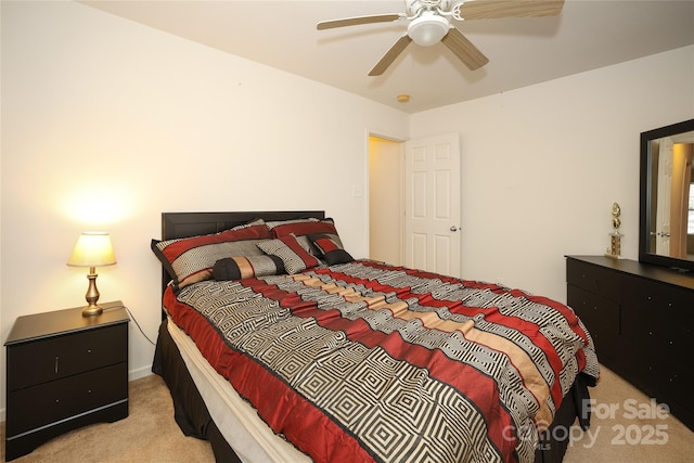 bedroom with ceiling fan and light carpet