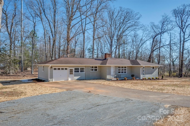 single story home with a garage