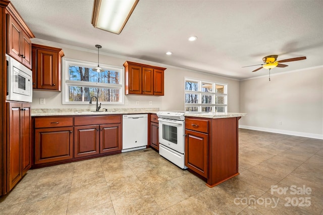 kitchen with ceiling fan, white appliances, pendant lighting, crown molding, and sink