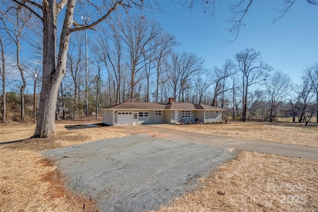 single story home with a garage