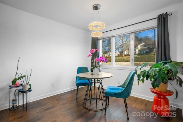 dining room with dark hardwood / wood-style flooring