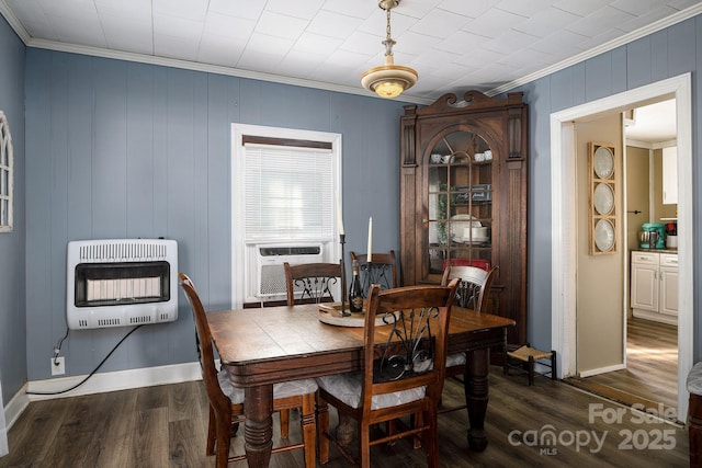 dining room featuring heating unit, cooling unit, dark wood-type flooring, and crown molding