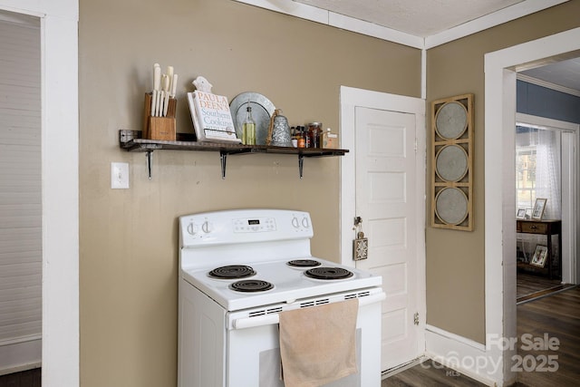 kitchen featuring dark wood-type flooring, white electric range, and crown molding