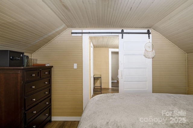 bedroom with lofted ceiling, wood walls, and wood ceiling