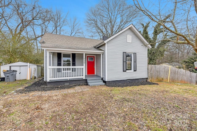 view of front facade with a porch and a storage unit