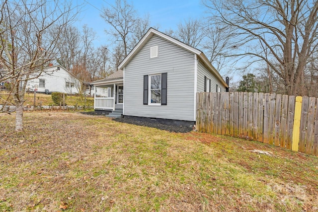 exterior space with a lawn and covered porch